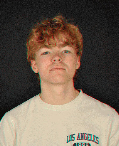 Portrait of the blog owner with face partially distorted through two clear glasses of water on a white table